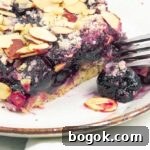 close up of a cherry almond pie bar