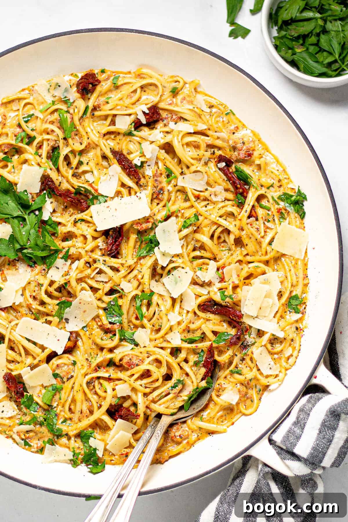 15-Minute Cream Tomato Pasta with Garlic and Basil 10 Large pan filled with linguine tossed in creamy tomato sauce.