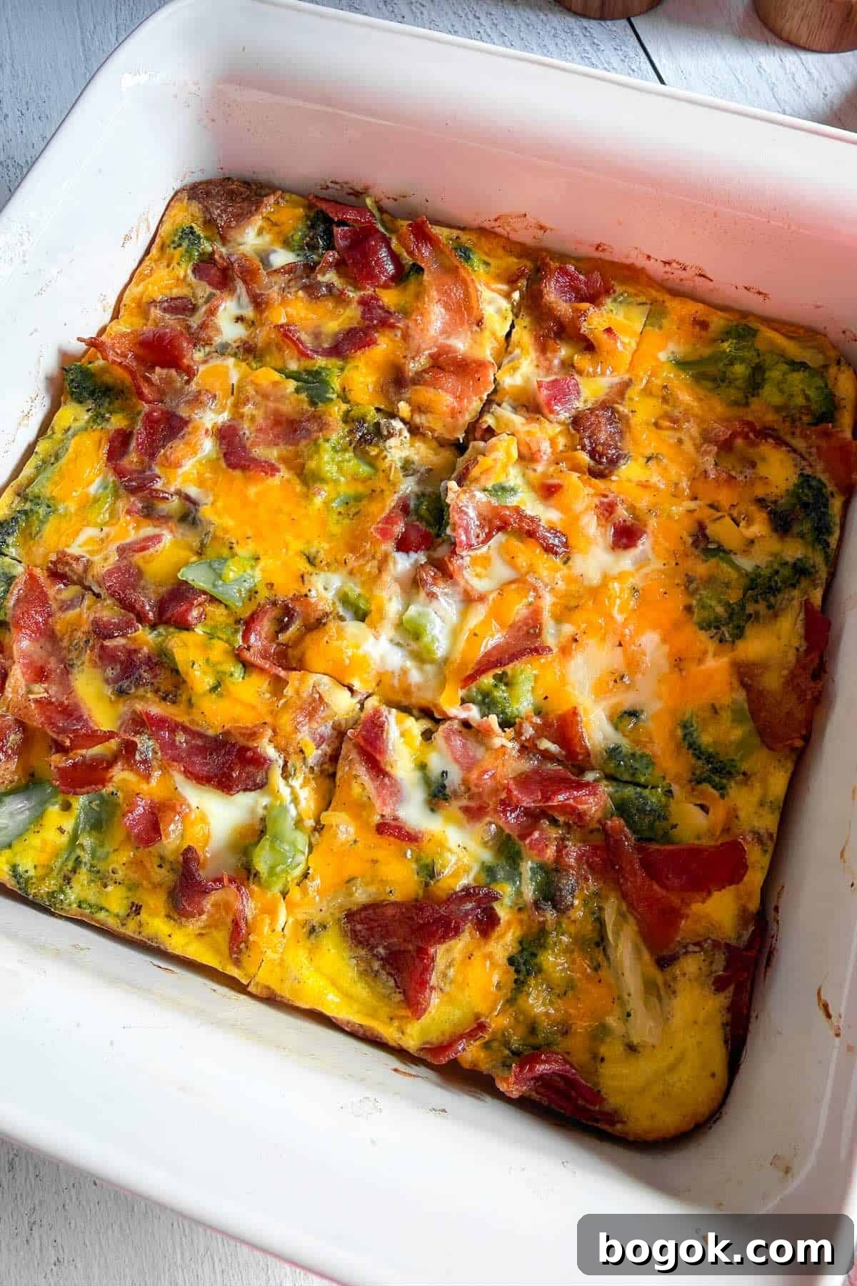 Low-Carb Bacon and Broccoli Breakfast Casserole 8 Freshly baked low carb breakfast casserole with bacon, broccoli, and melted cheddar cheese.
