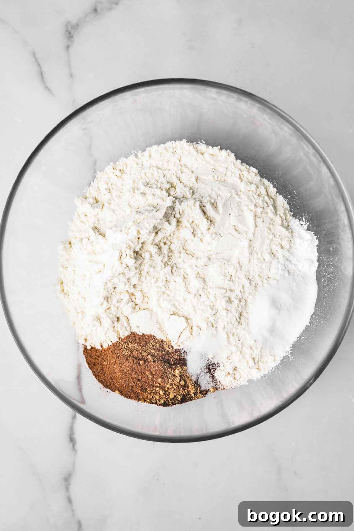Soft Molasses Gingerbread Cookies Recipe 4 medium bowl with flour and spices for gingerbread cookies