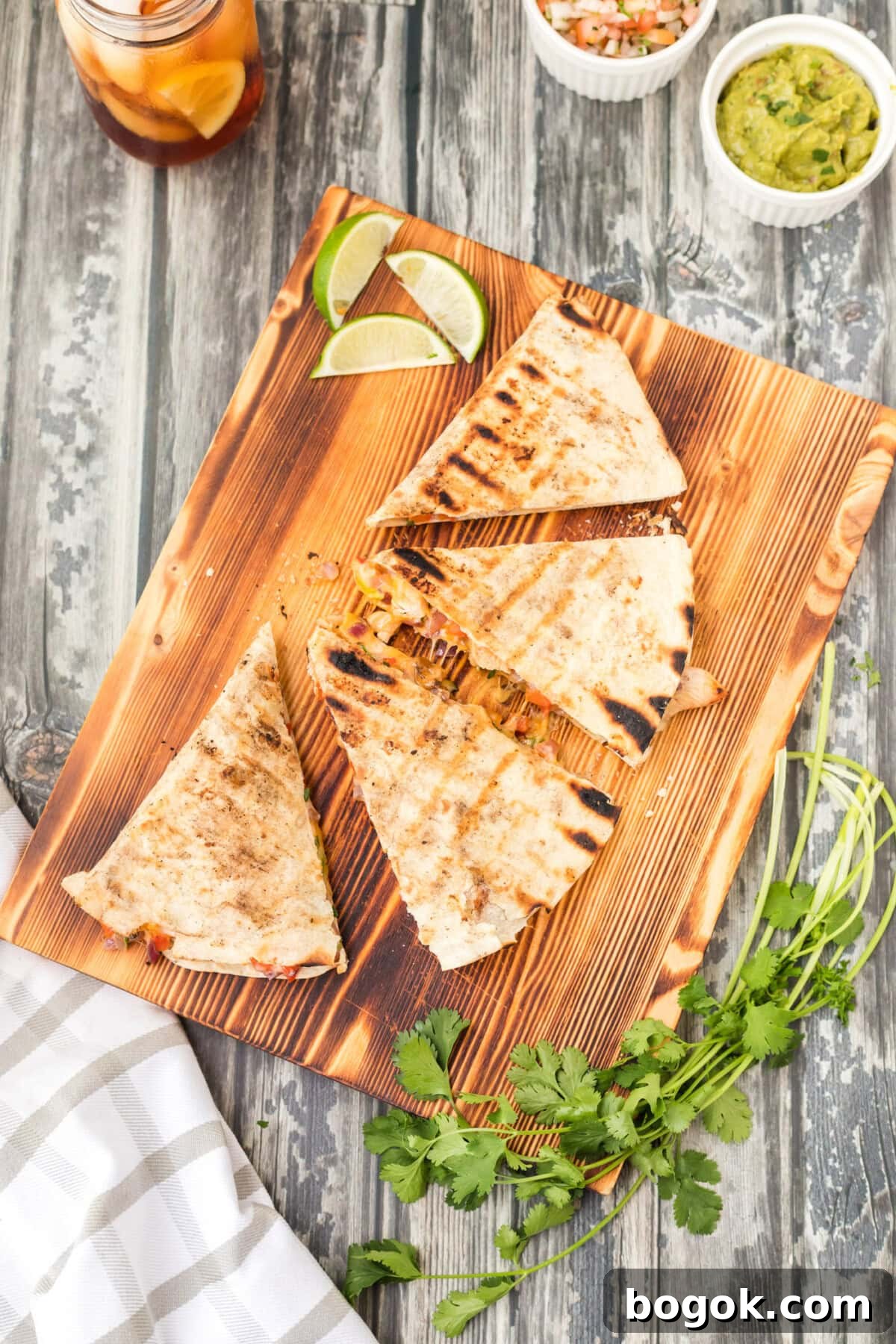 Grilled Chicken Quesadilla Recipe for Crispy, Cheesy Results 3 Grilled Chicken Quesadilla on cutting board