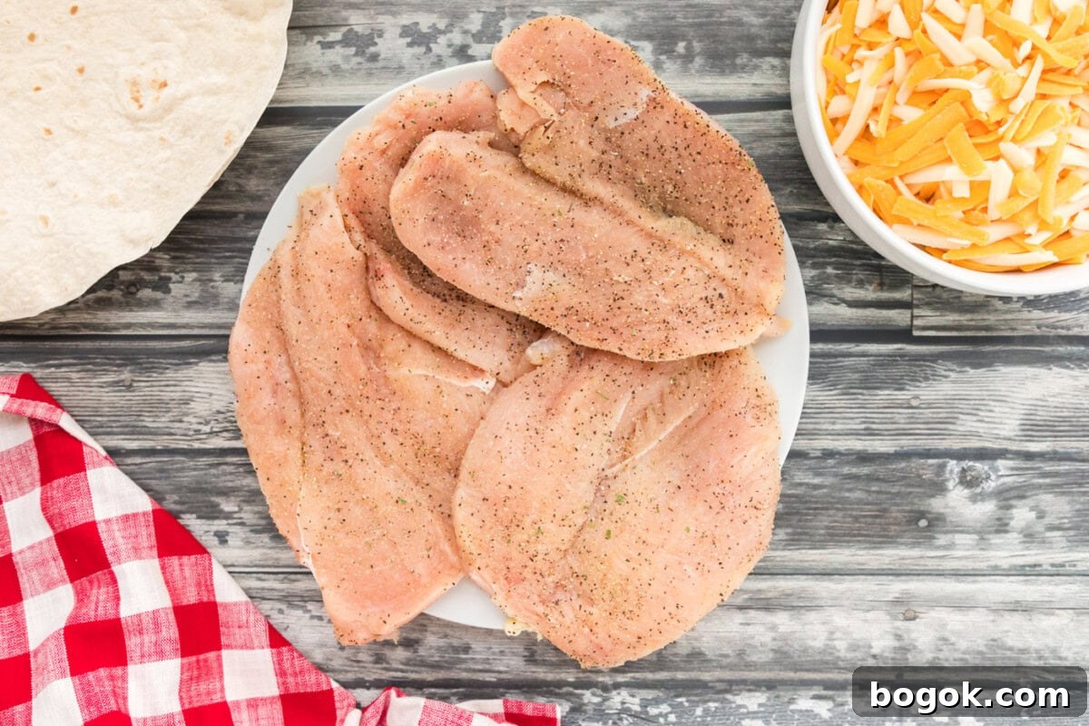Grilled Chicken Quesadilla Recipe for Crispy, Cheesy Results 5 seasoned chicken breasts on a plate