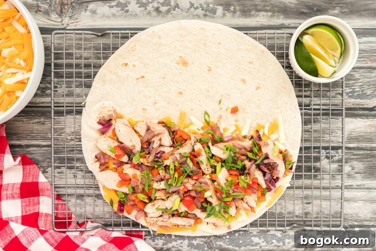 Grilled Chicken Quesadilla Recipe for Crispy, Cheesy Results 9 chicken, bell peppers, and onions over cheese quesadilla