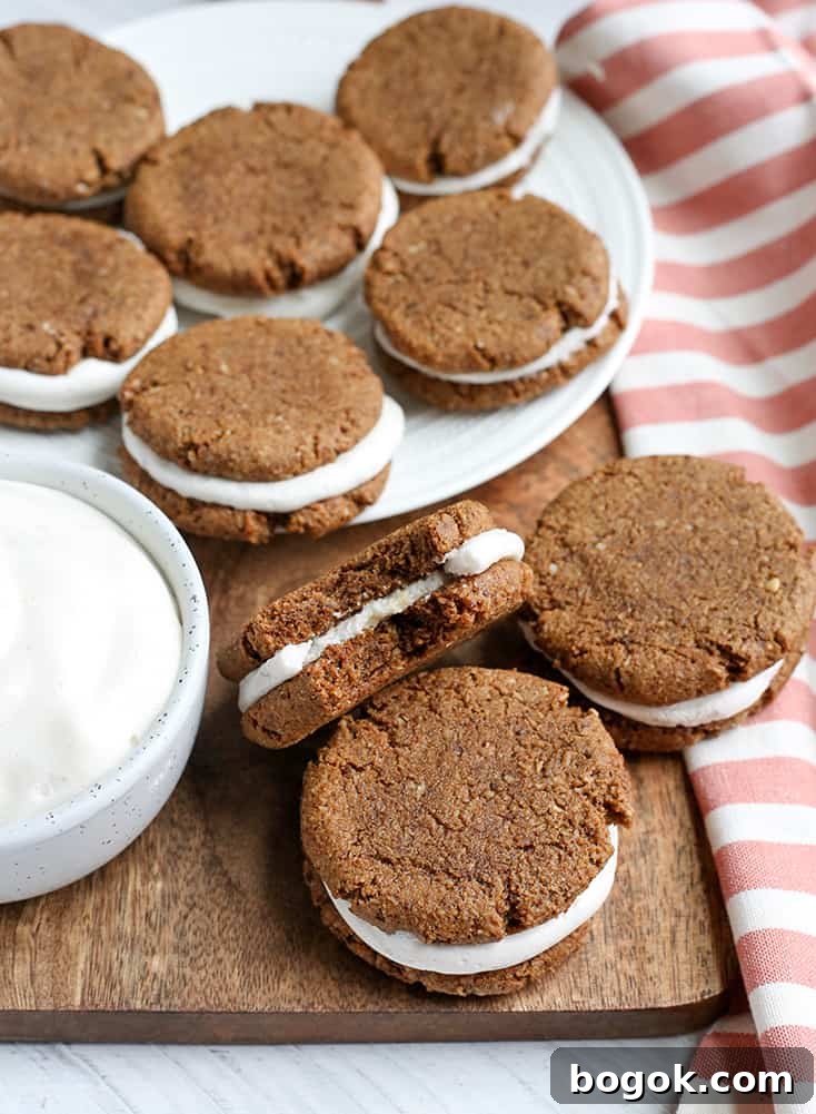These Paleo Oatmeal Cream Pies contain no oatmeal, but still have the same taste and texture. A soft, sweet cookie with a marshmallow filling. Gluten free, dairy free, and naturally sweetened.
