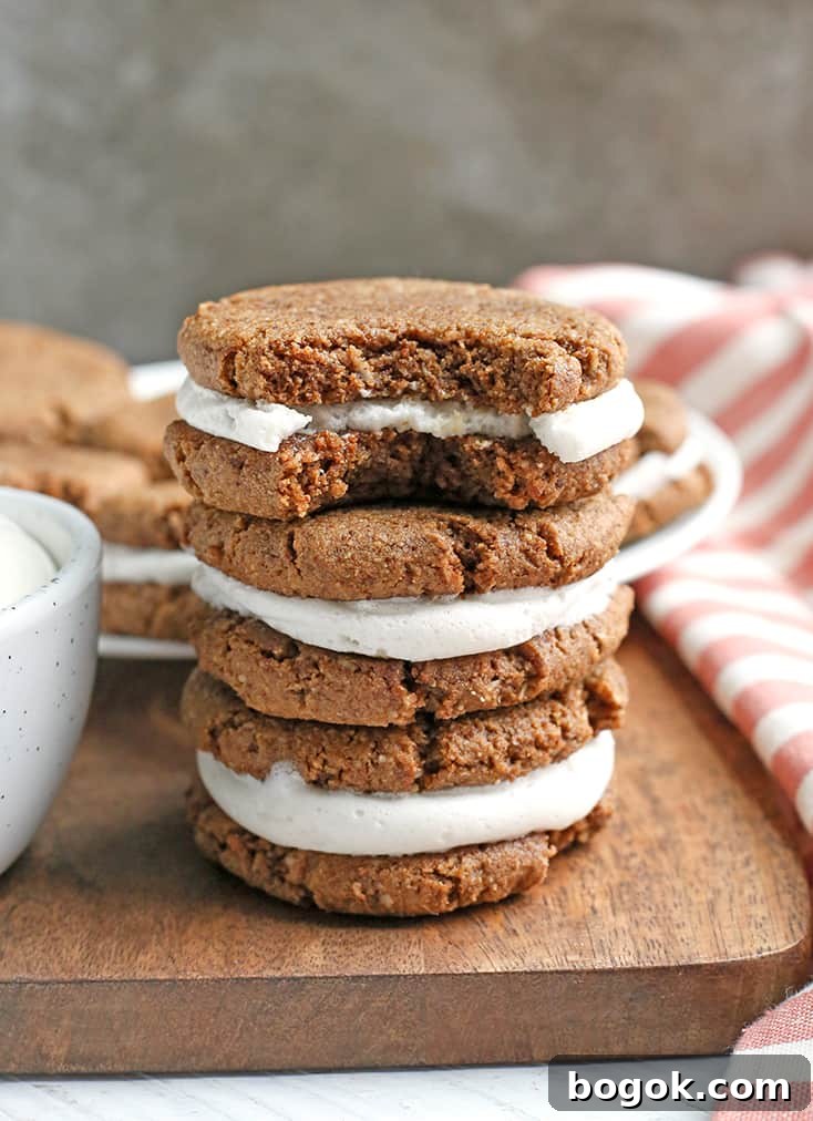 These Paleo Oatmeal Cream Pies contain no oatmeal, but still have the same taste and texture. A soft, sweet cookie with a marshmallow filling. Gluten free, dairy free, and naturally sweetened.