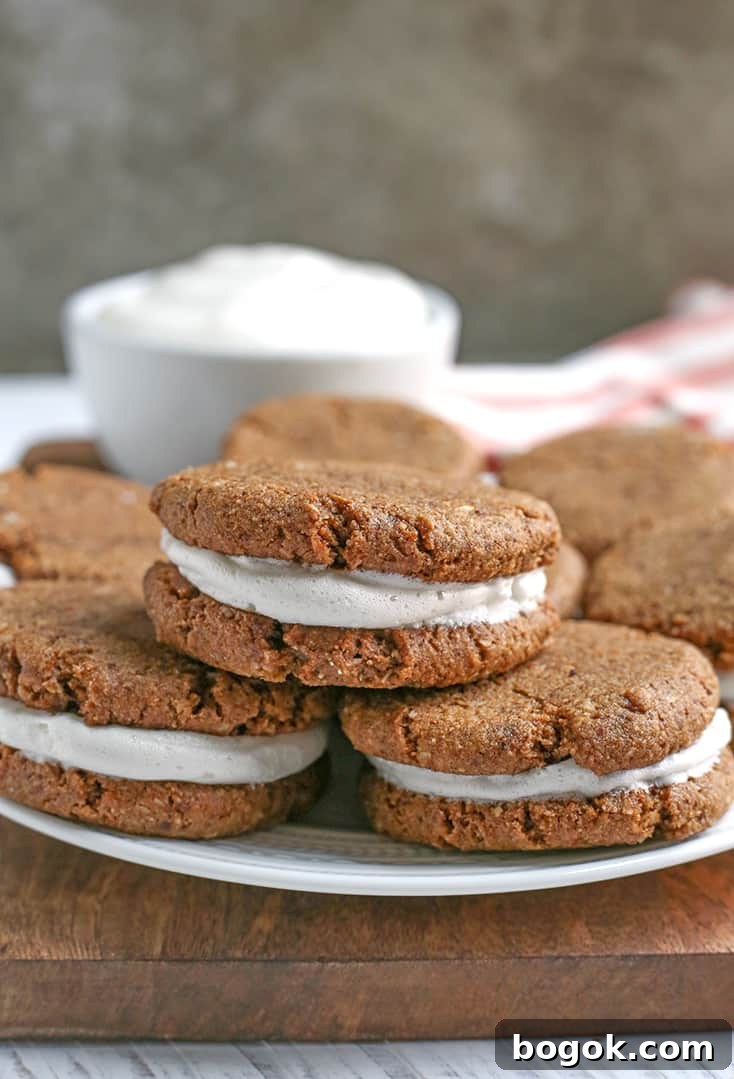 These Paleo Oatmeal Cream Pies contain no oatmeal, but still have the same taste and texture. A soft, sweet cookie with a marshmallow filling. Gluten free, dairy free, and naturally sweetened.