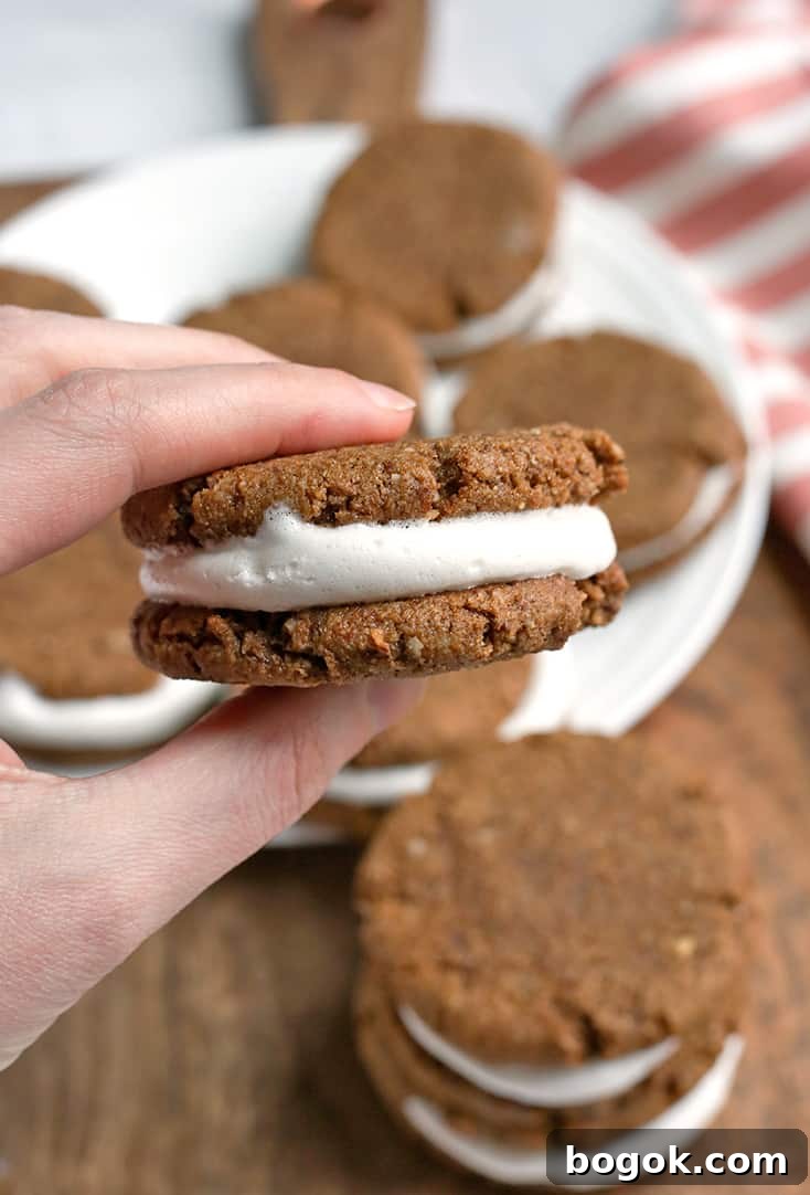 These Paleo Oatmeal Cream Pies contain no oatmeal, but still have the same taste and texture. A soft, sweet cookie with a marshmallow filling. Gluten free, dairy free, and naturally sweetened.