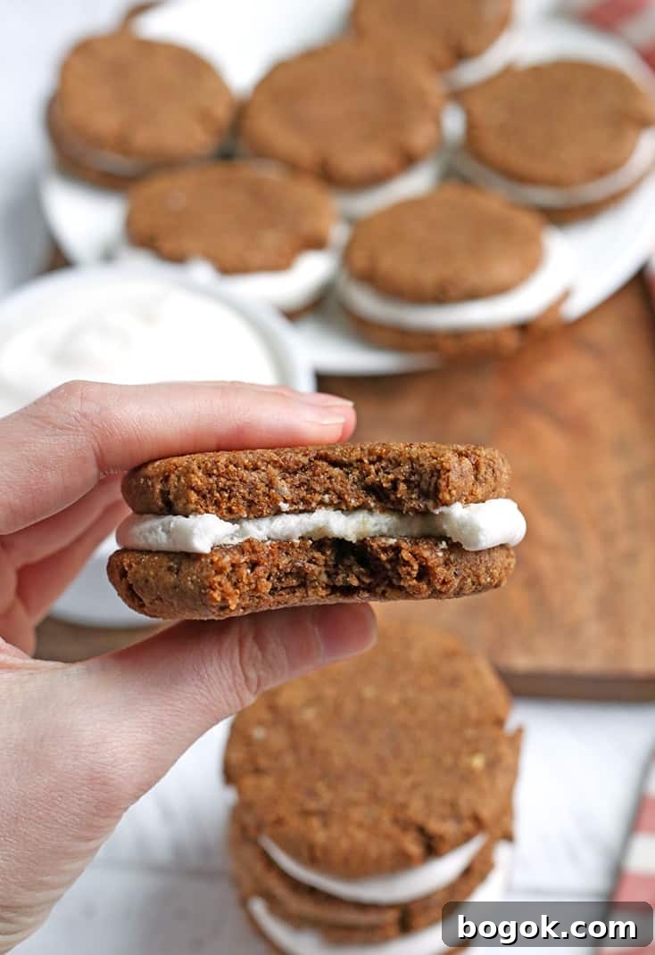 These Paleo Oatmeal Cream Pies contain no oatmeal, but still have the same taste and texture. A soft, sweet cookie with a marshmallow filling. Gluten free, dairy free, and naturally sweetened.