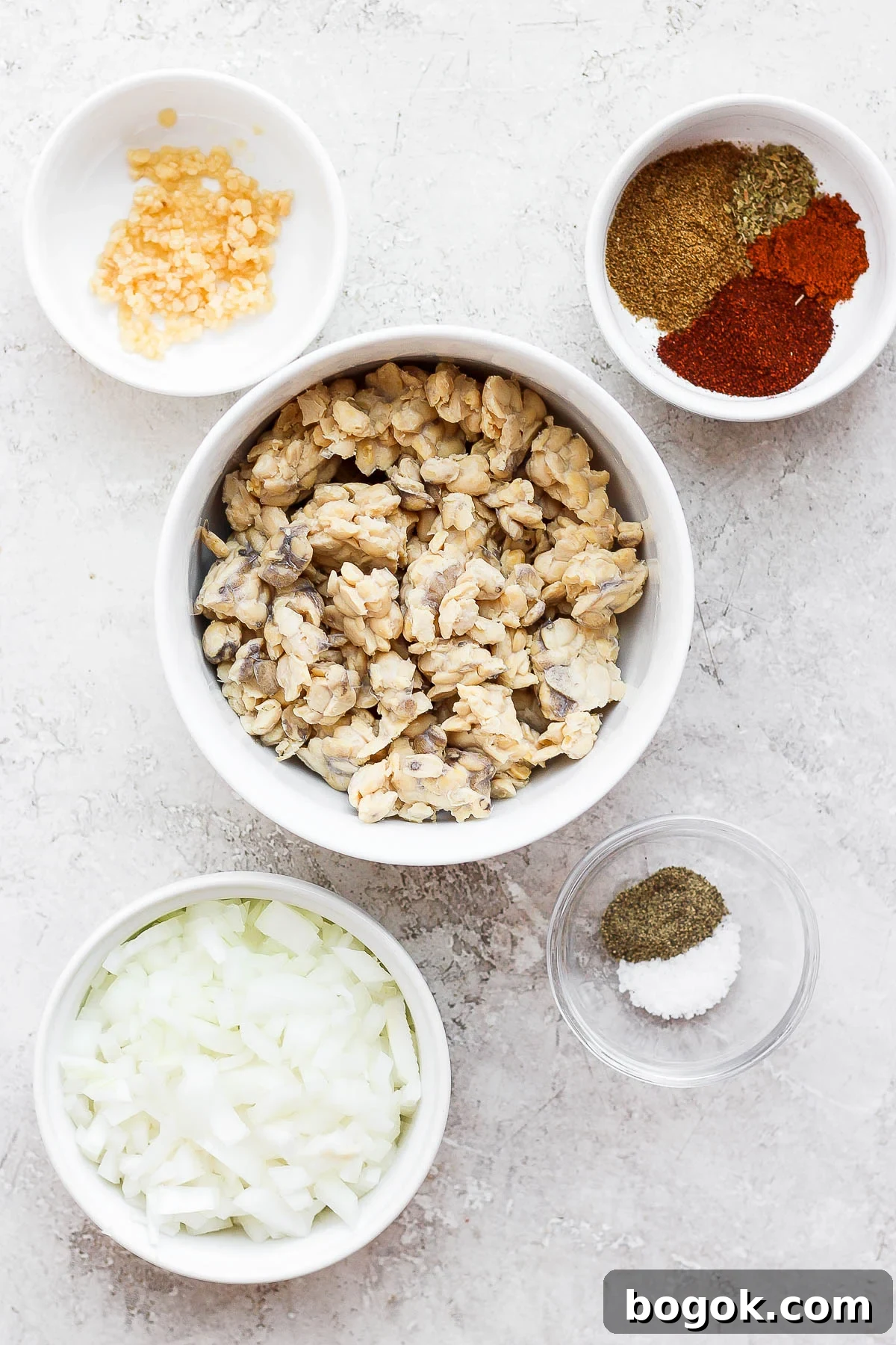 Flavorful Tempeh Tacos with Zesty Avocado Slaw 7 ingredients laid out for tempeh tacos