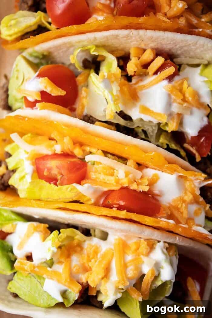 Philly Cheesesteak Keto Lettuce Wraps — Low-Carb Dinner Option 11 overhead view of 4 tacos with 2 in cheese shells and 2 in tortillas with meat, lettuce, tomato, cheese and avocado