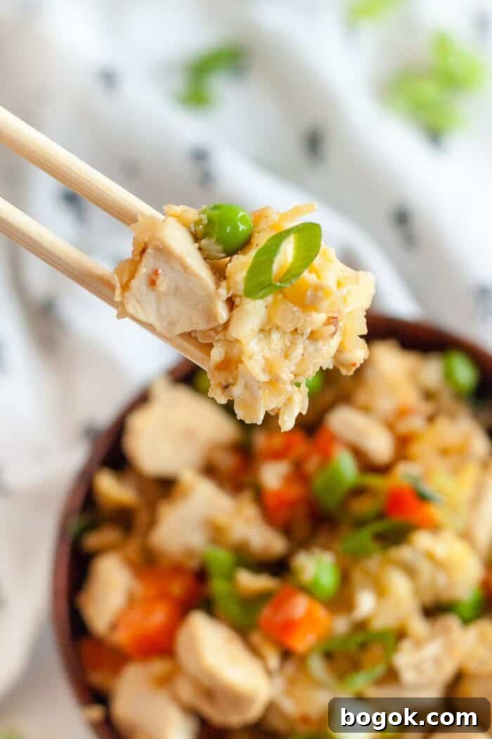 Philly Cheesesteak Keto Lettuce Wraps — Low-Carb Dinner Option 18 chopsticks holding low carb chicken and rice over top a large bowl
