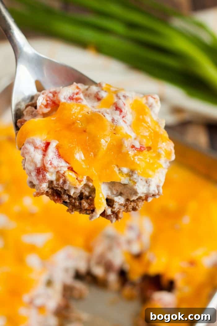 Philly Cheesesteak Keto Lettuce Wraps — Low-Carb Dinner Option 7 keto casserole beef and tomato on spoon being served