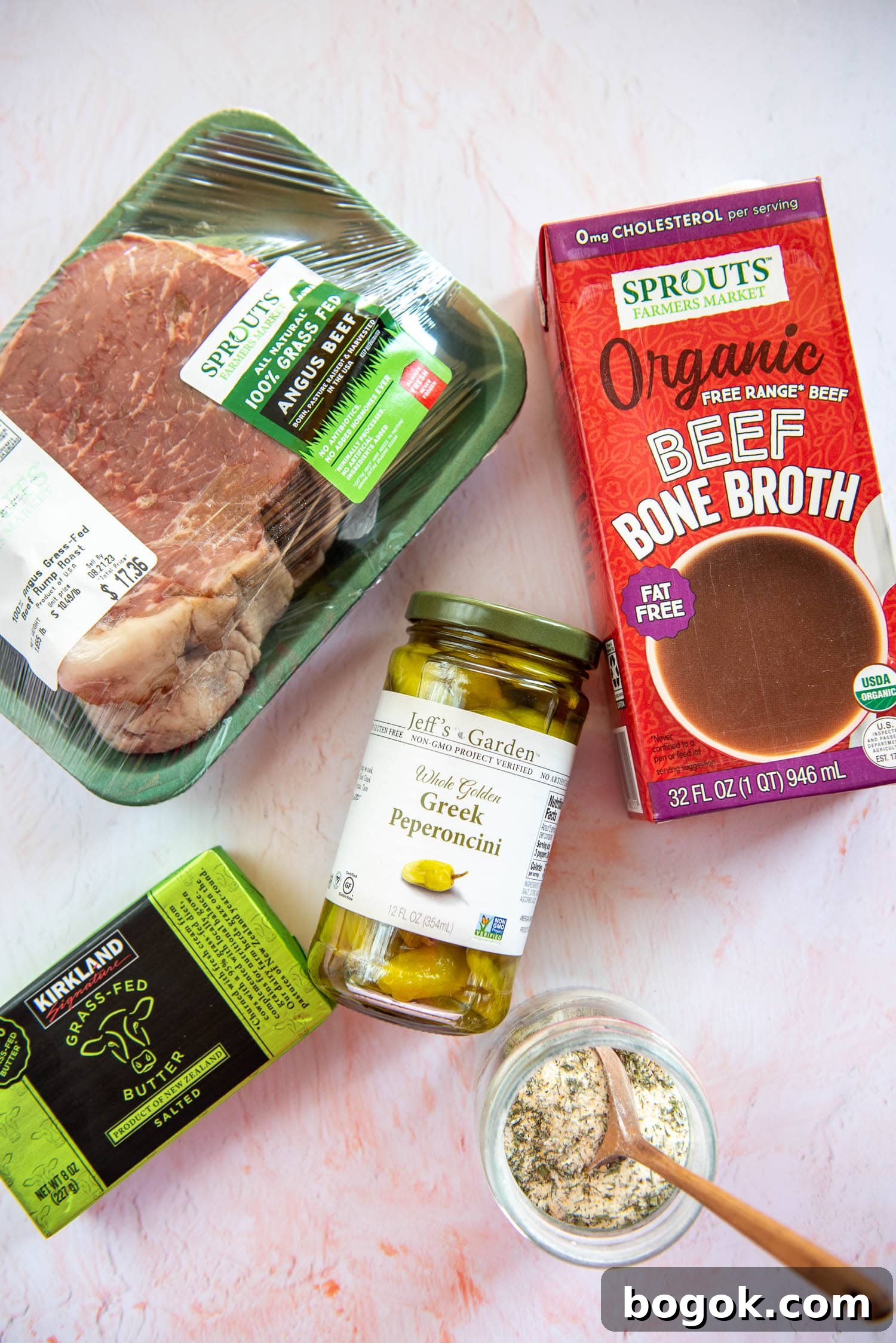 Mississippi Pot Roast Recipe for Tender Slow-Cooker Comfort 3 1.8 lb packed of uncooked Angus beef, 8oz pack of grassfed butter, spices in a bowl with wooden spoon, jar of 12 oz greek peperoncini