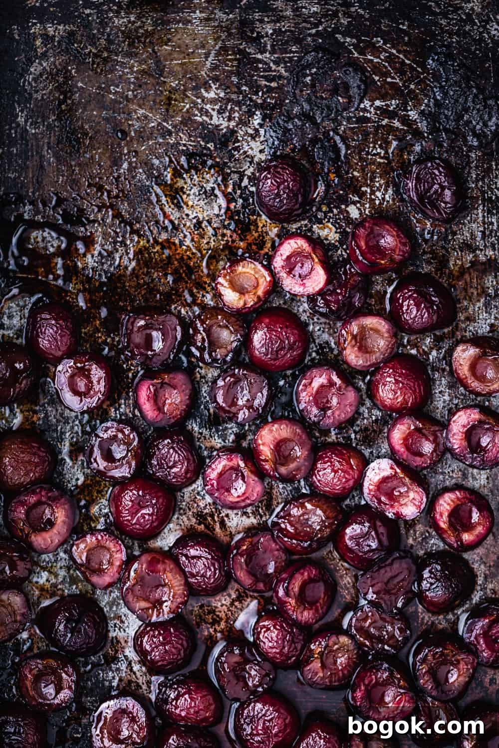 Roasted Cherries in 15 Minutes: Sweet, Syrupy Recipe 4 Roasted pitted cherries, on a cookie sheet, straight out of the oven.