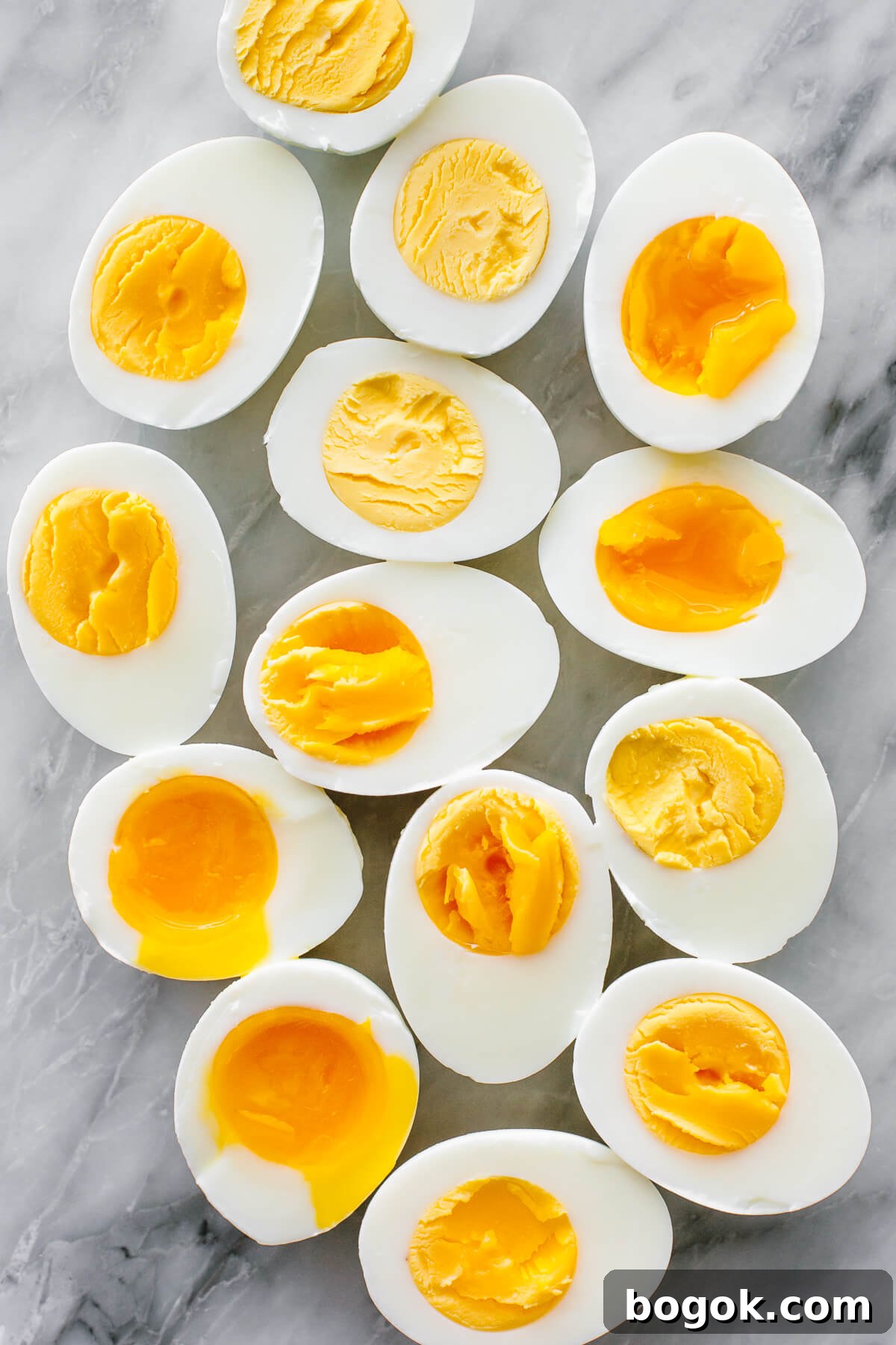 Hard boiled and soft boiled eggs on a counter