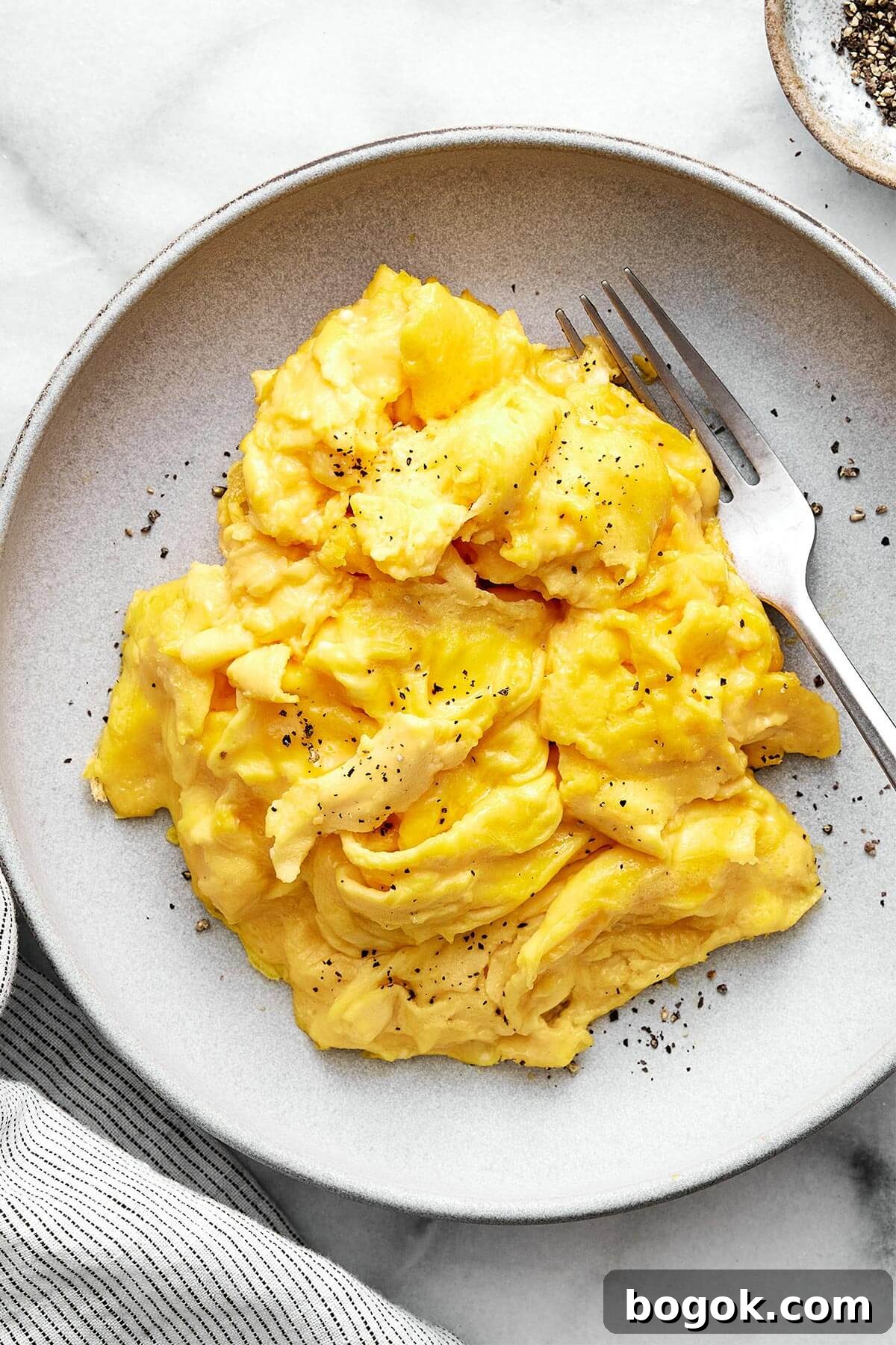 A plate of scrambled eggs.