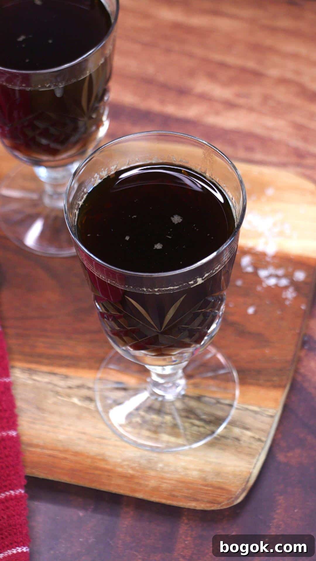 An angled view of a cocktail glass containing a homemade whiskey cocktail - Hostess At Heart