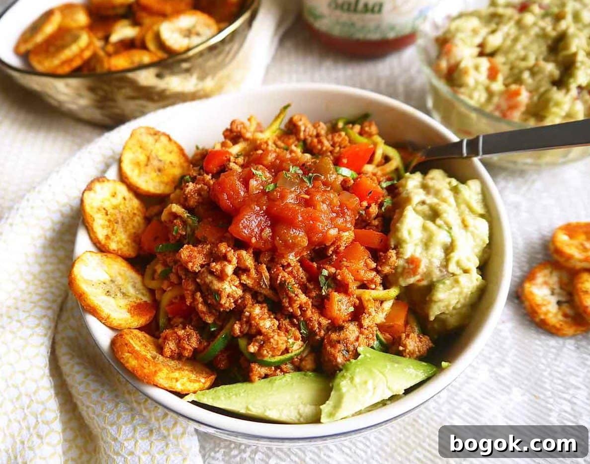 Ground Turkey Tacos with Zucchini Noodles (Zoodles) 3 A taco bowl made of ground turkey, zoodles, and other taco sides.
