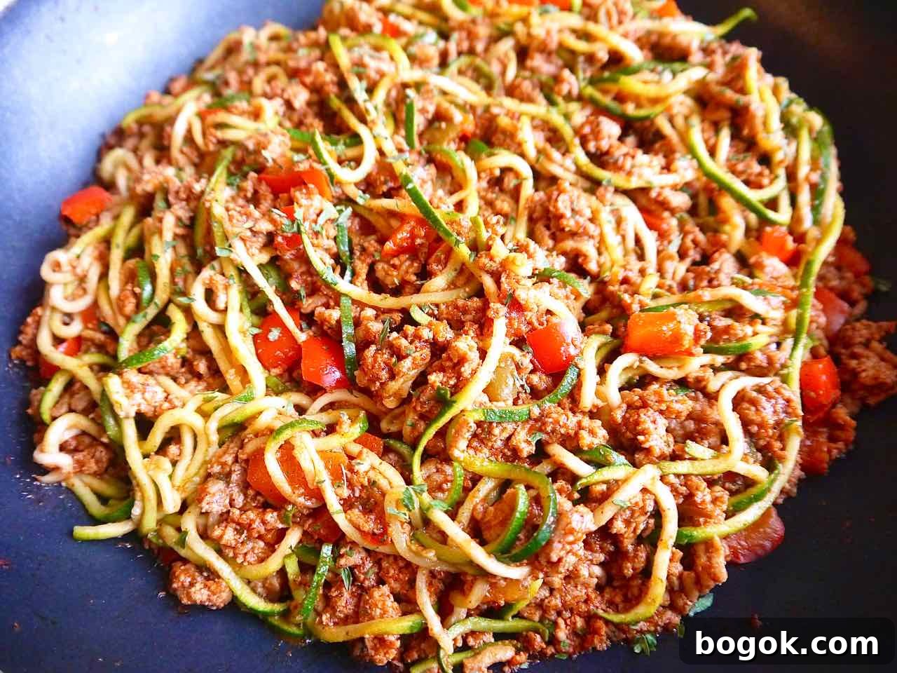 Ground Turkey Tacos with Zucchini Noodles (Zoodles) 7 Mixing the taco meat with zoodles.