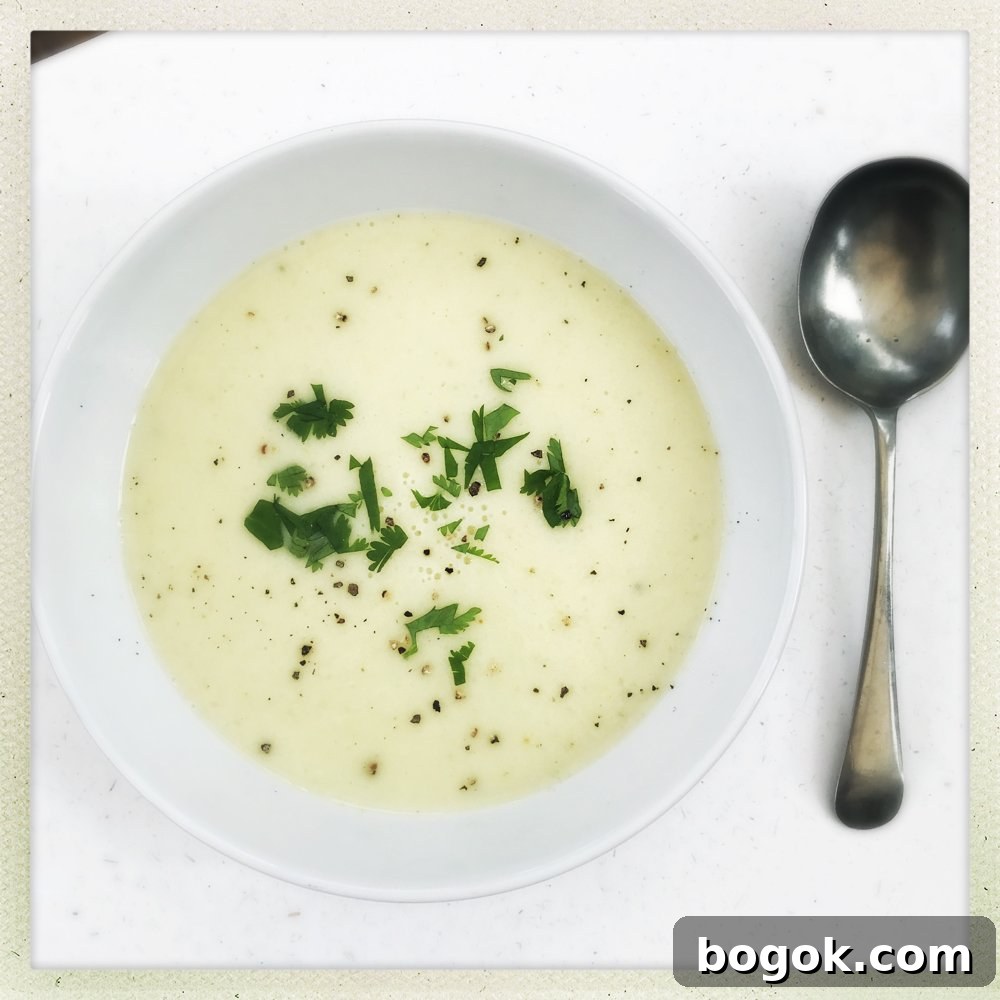 Creamy Roasted Sweet Potato Soup Recipe 3 bowl of homemade leek and potato soup sprinkled with chopped parsley and black pepper
