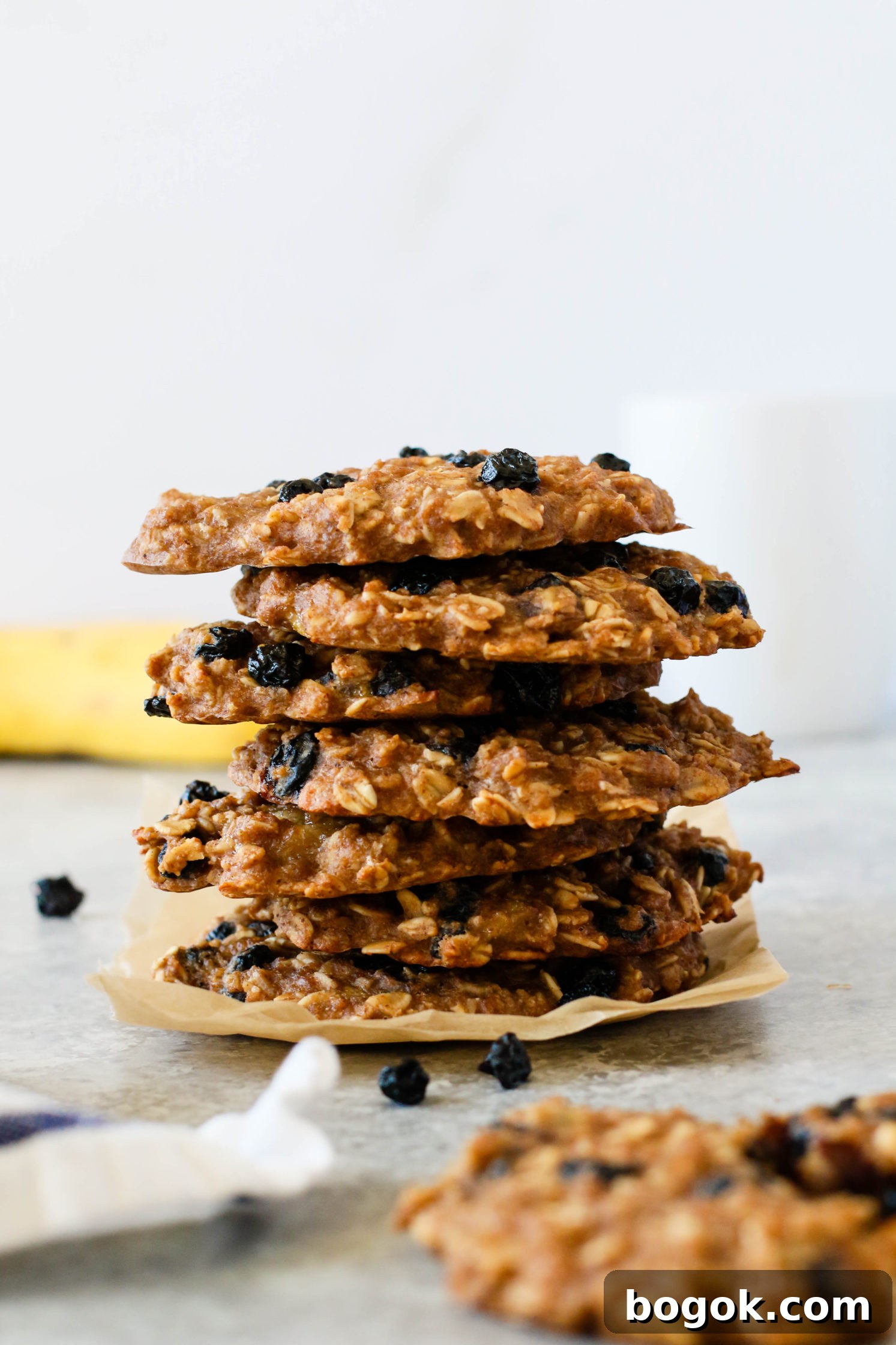 Blueberry Banana Breakfast Cookies stacked on parchment paper 