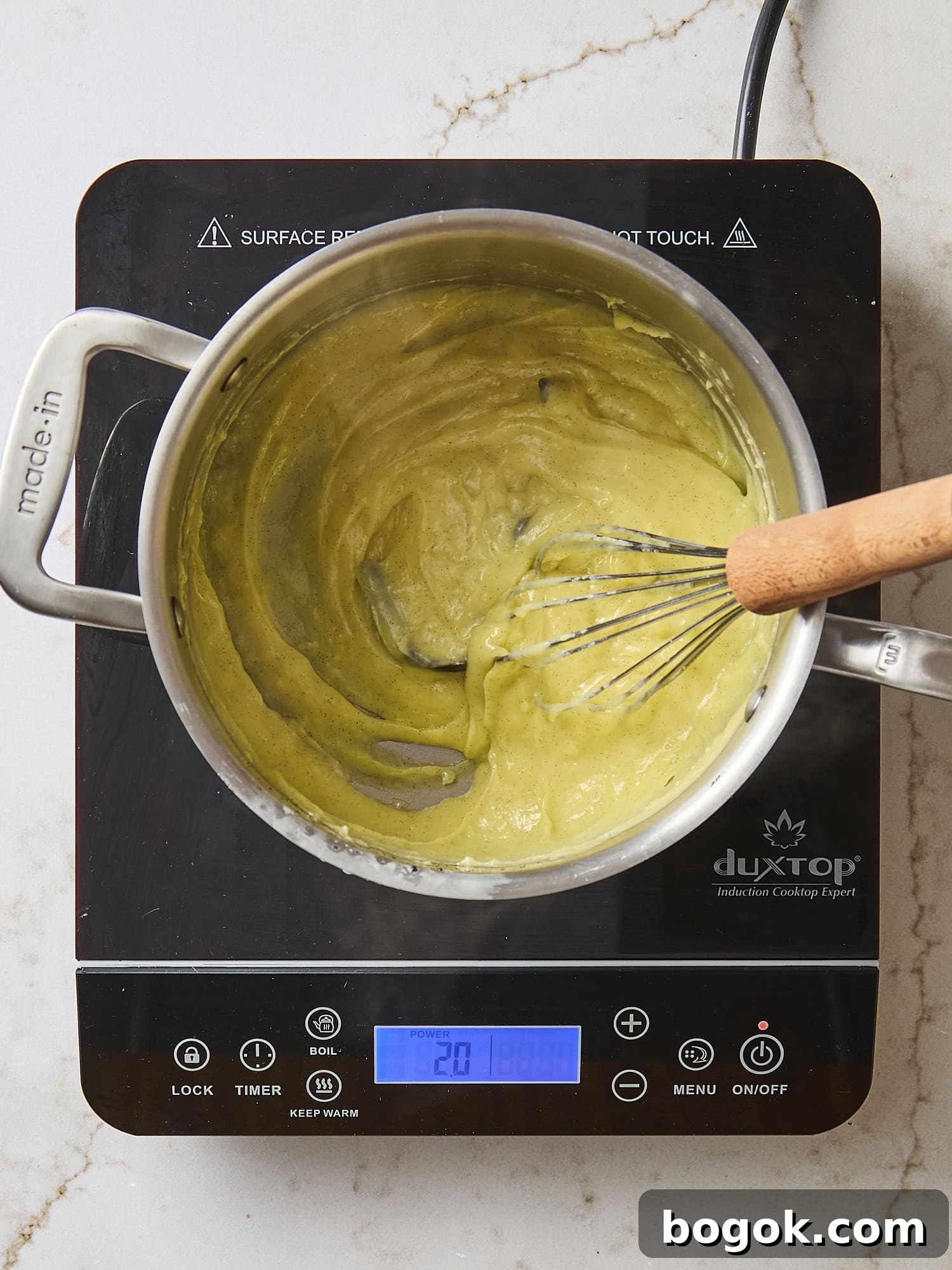 Cooked pastry cream mixture in saucepan.