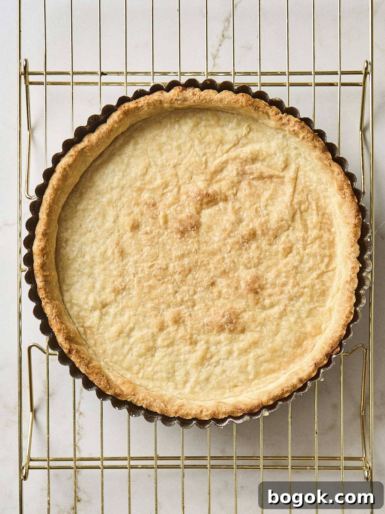 Baked dough in a tart shell for fruit tart.