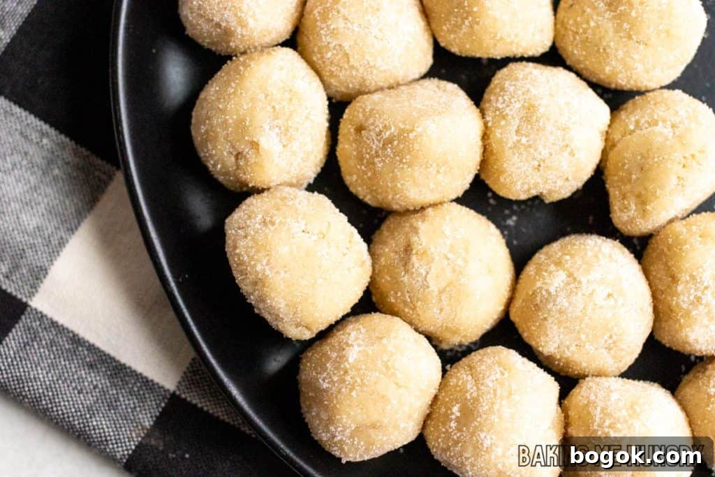 Safe-to-Eat Sugar Cookie Dough Recipe 9 balls of edible sugar cookie dough on plate
