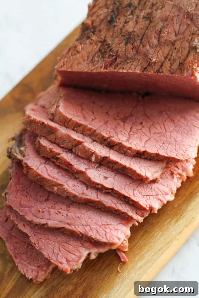 Stovetop Corned Beef: Tender, Flavorful Recipe and Tips 2 slices of the meat on the wooden serving tray