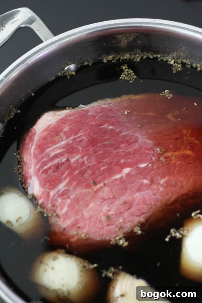 Stovetop Corned Beef: Tender, Flavorful Recipe and Tips 5 the meat in a saucepan filled with water