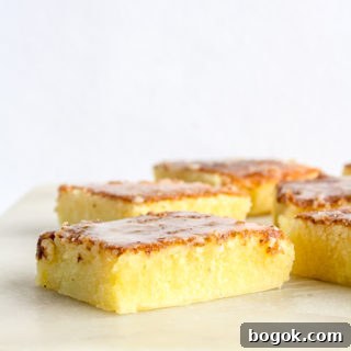 Moist, dense and gooey lemon blondies with lemon glaze
