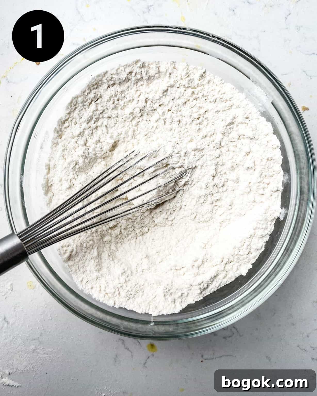 Chewy Peanut Butter Cookie Recipe for Perfect Texture 5 dry ingredients whisked together in a bowl.