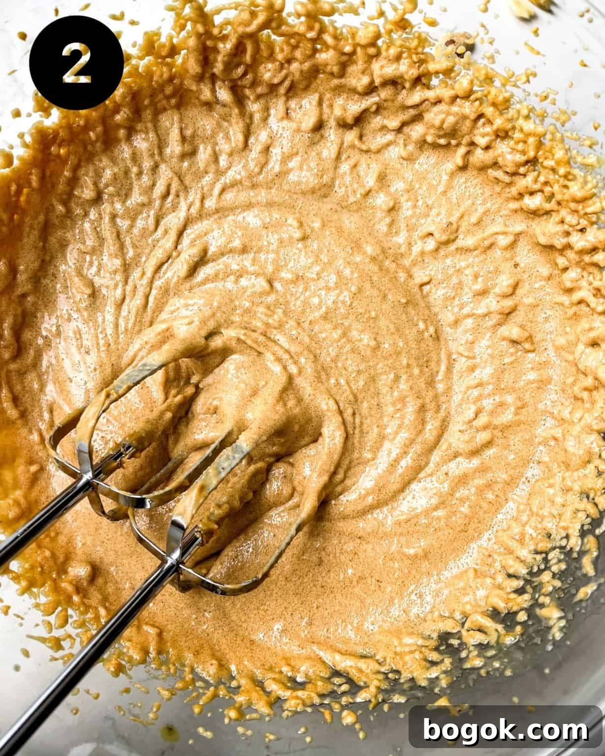 Chewy Peanut Butter Cookie Recipe for Perfect Texture 6 peanut butter, butter, and sugar mixed together in a mixing bowl.