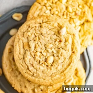 Chewy Peanut Butter Cookie Recipe for Perfect Texture 9 peanut butter cookies on a silver plate.