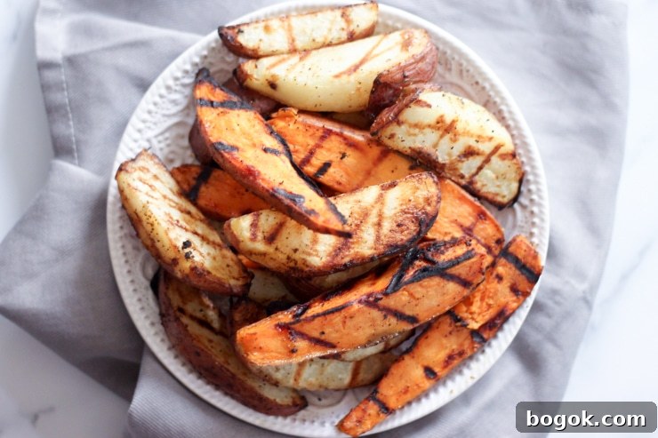 Crispy Grilled Potato Wedges with Garlic Herb Dip 11 freshly grilled potatoes on a white plate