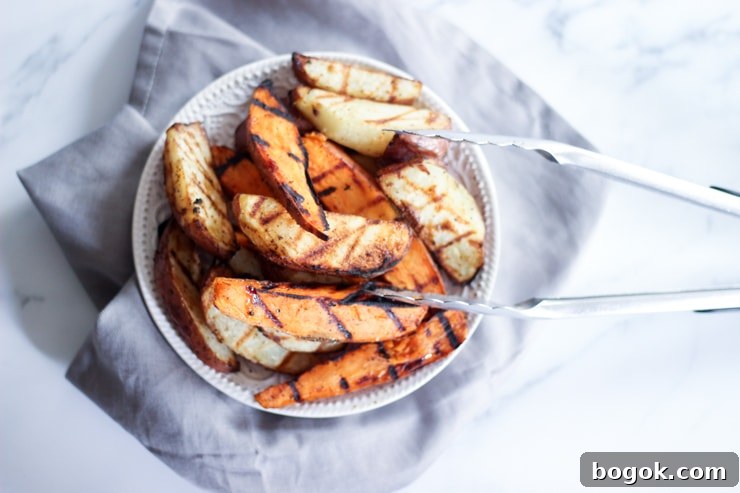 Crispy Grilled Potato Wedges with Garlic Herb Dip 16 freshly grilled potatoes on a white kitchen counter