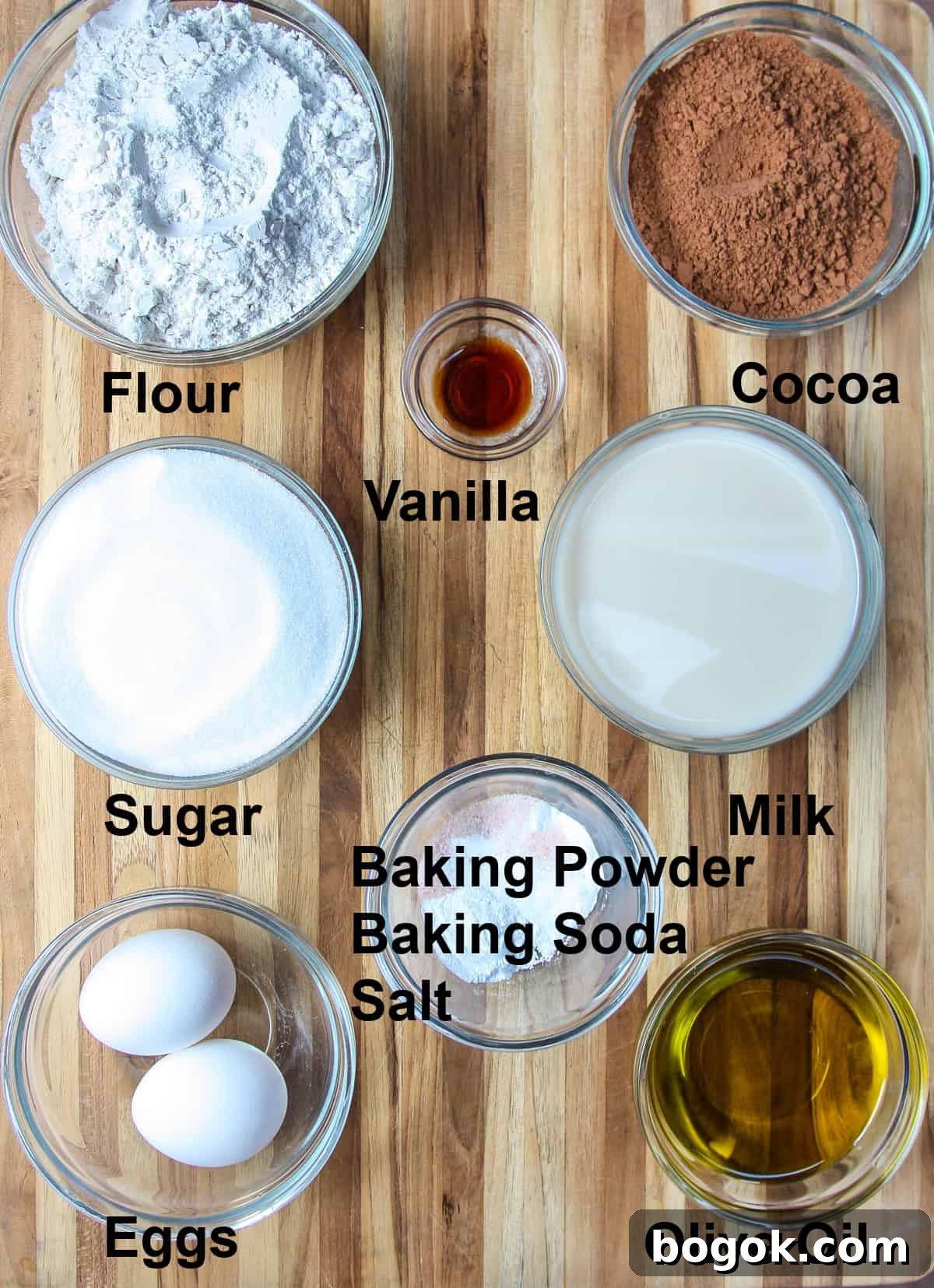 Moist Fluffy Air Fryer Cake Recipe 4 All of the ingredients needed for the air fryer cake on a wooden board.