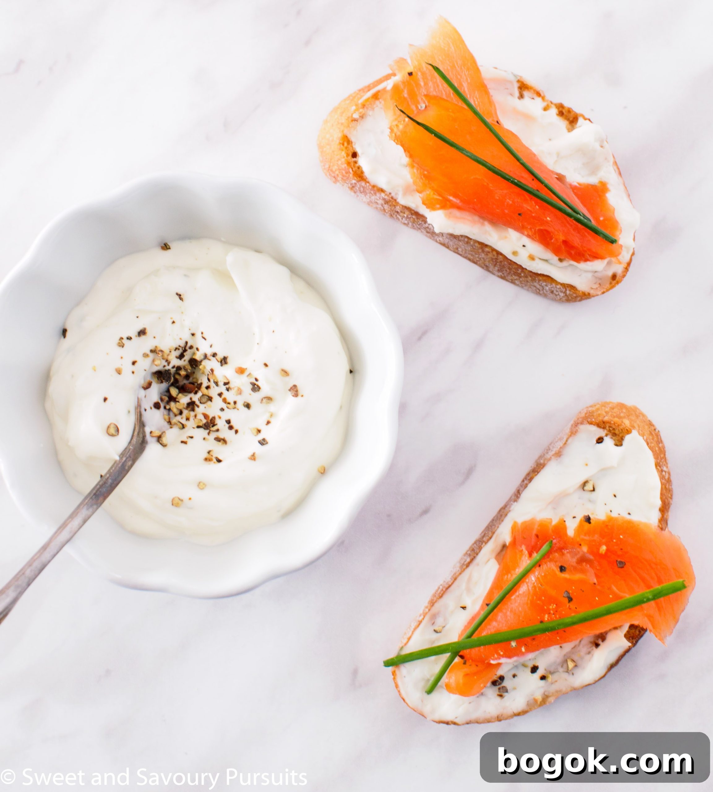 Smoked Salmon and Boursin Crostini Recipe for Entertaining 3 Top view of Smoked Salmon and Boursin Crostini with chives.