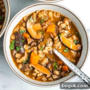 Hearty Vegan Miso Mushroom and Barley Soup Recipe 19 Rich tomato broth with mushrooms, barley, carrots and sprinkled with fresh herbs.