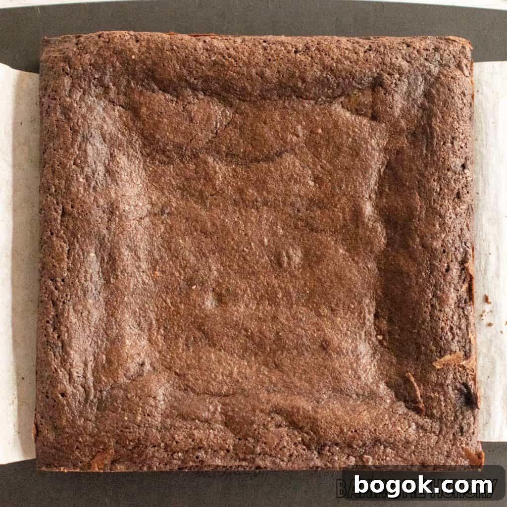 After Eight Mint Brownies Recipe — Classic Chocolate Mint Treat 12 baked brownie whole on cutting board