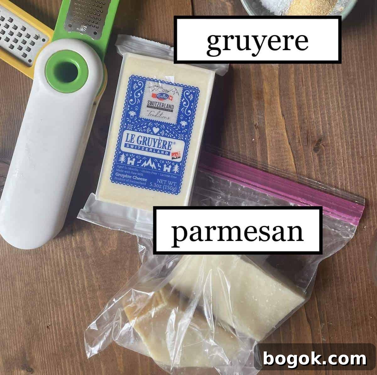 Baked Cheesy Chicken and Broccoli Noodle Casserole 4 Two blocks of parmesan cheese and a block of gruyere with a grater, labeled.