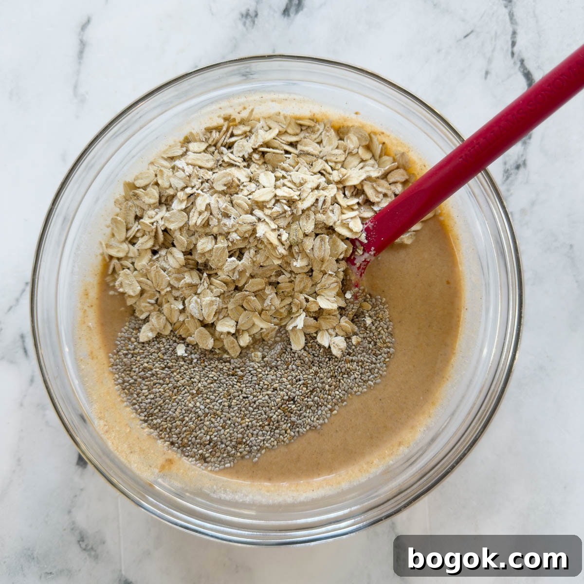 Pumpkin Overnight Oats Ready in 5 Minutes 6 Overnight pumpkin oats base with chia seeds in a glass bowl.