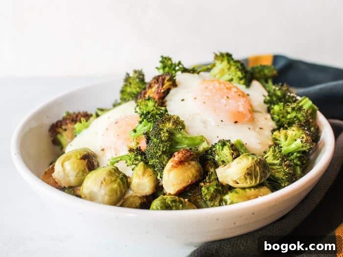 Two bowls with roasted vegetables and baked eggs