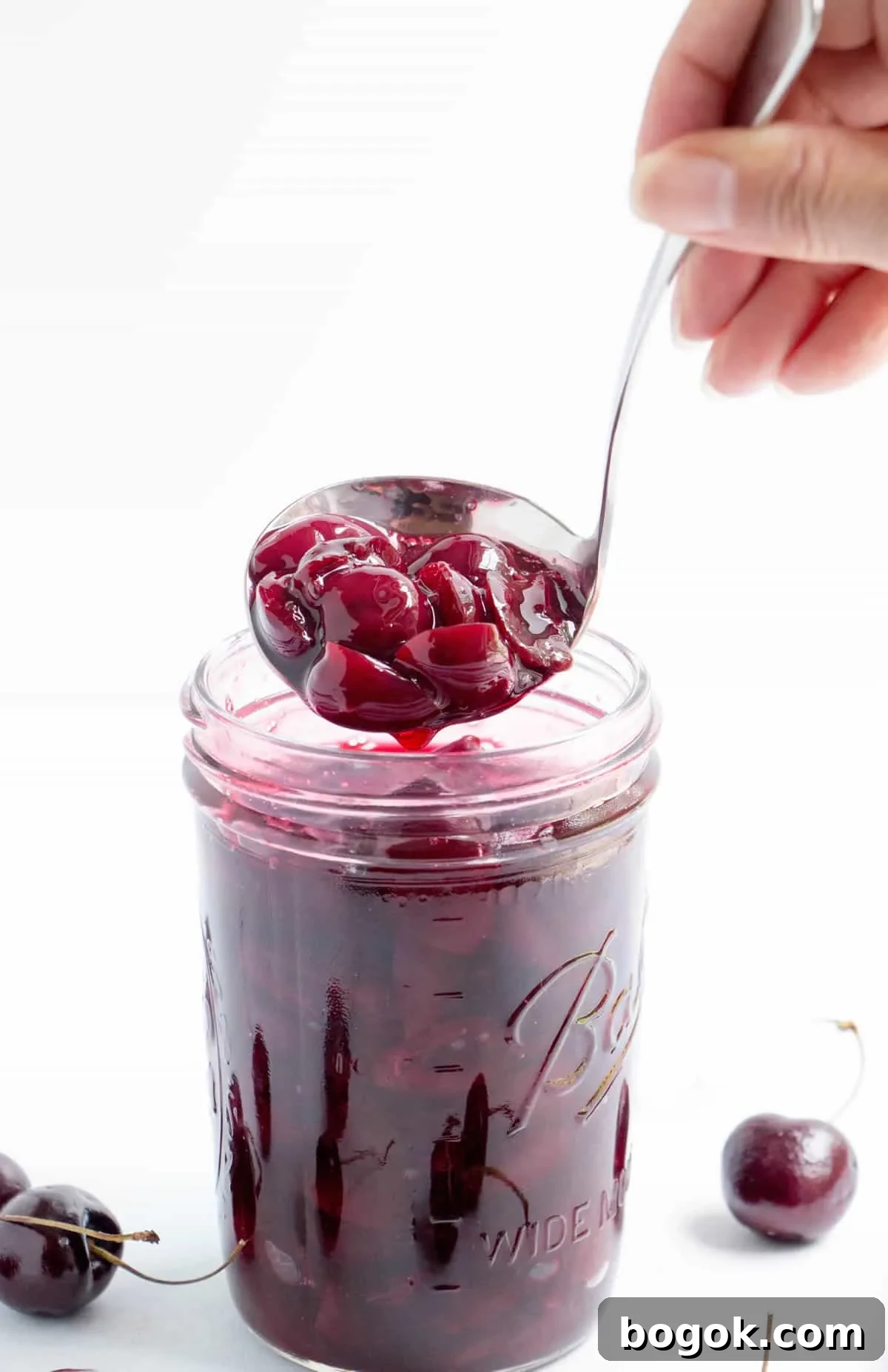 How to Make Fresh Sweet Cherry Sauce 6 Closeup ladling of Fresh Sweet Cherry Sauce