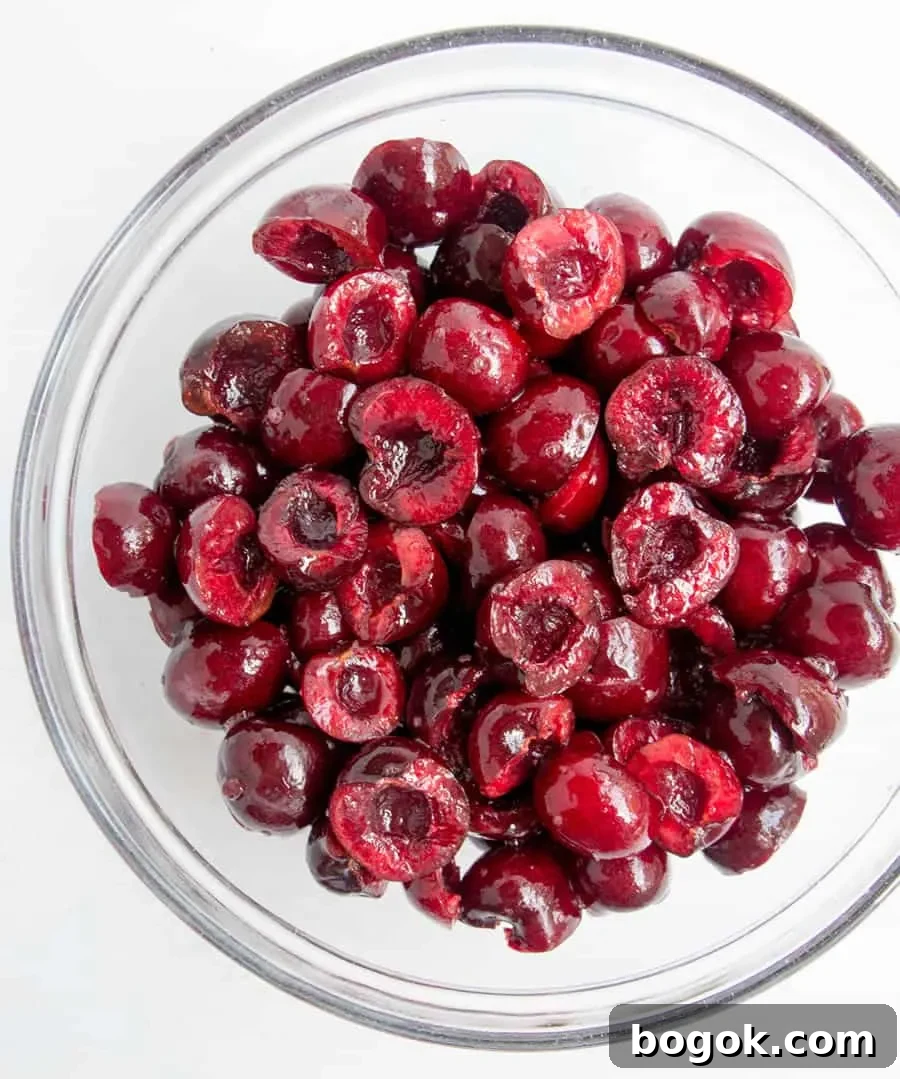 How to Make Fresh Sweet Cherry Sauce 7 Fresh cherries halved in a bowl