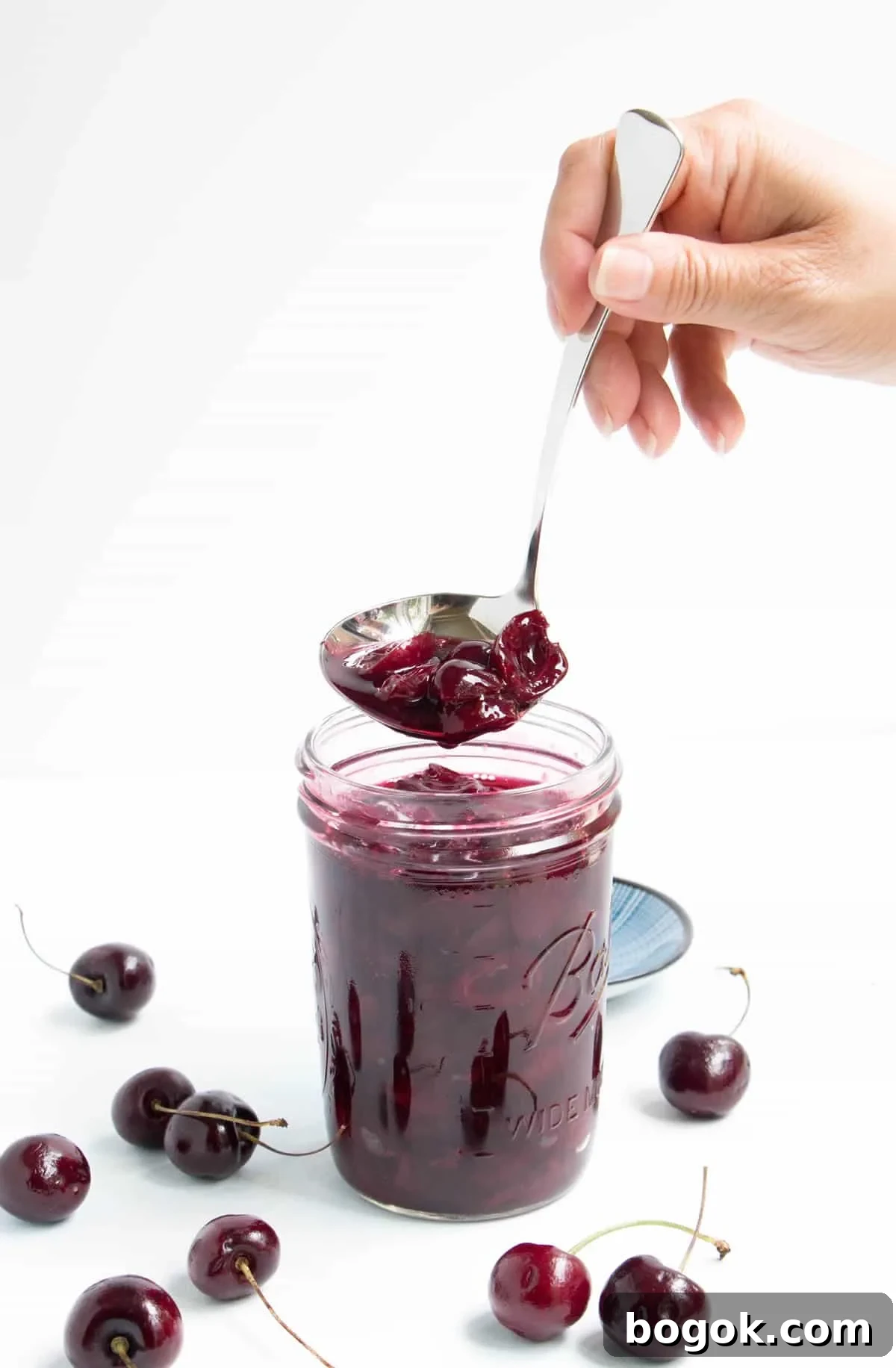 How to Make Fresh Sweet Cherry Sauce 5 Ladling Fresh Sweet Cherry Sauce from a jar