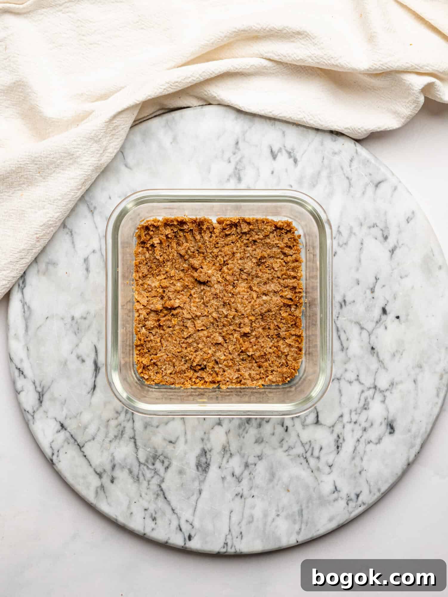 Lemon Cheesecake Overnight Weet-Bix Recipe 8 Crushed Weet-Bix mixed with milk and pressed into a glass container to form the base for lemon cheesecake overnight Weet-Bix.