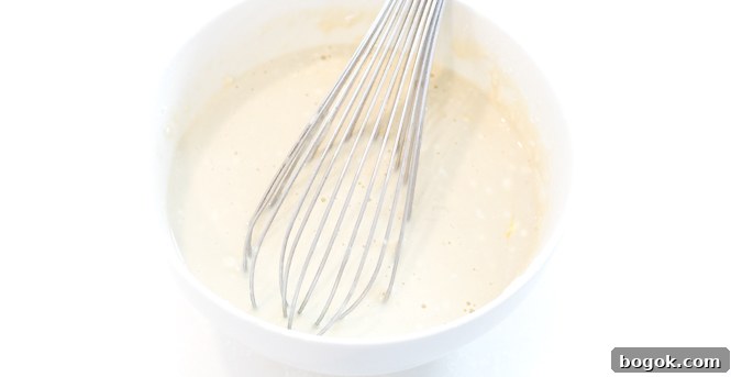 Pancake batter in large white bowl