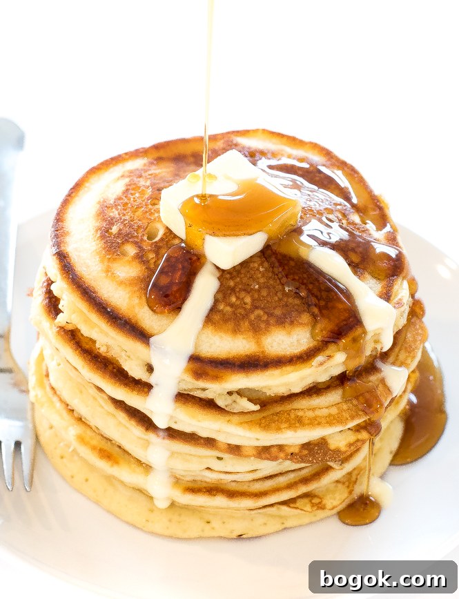 Greek Yogurt Pancakes drizzled with maple syrup and butter