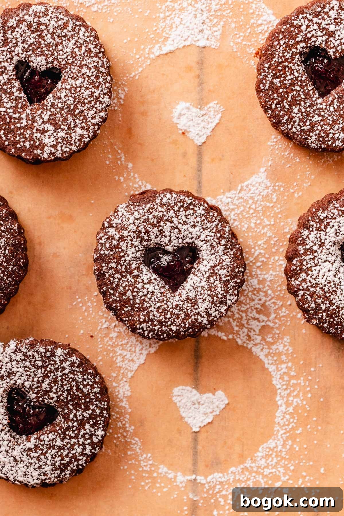 Chocolate Almond Cherry Linzer Cookies Recipe 2 chocolate almond linzer cookies with cherry jam filling